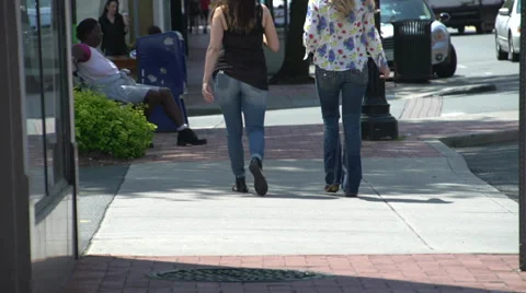 Sauntering down the street (2 of 2) Video stock 32302422
