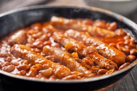 Sausage and Beans with Tomato Sauce on a pan. Stock Photos