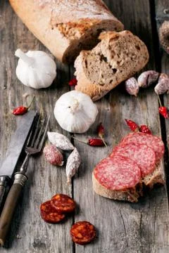 Sausage and bread Stock Photos