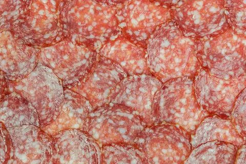 Sausage background (texture, pattern) from sausage slices Stock Photos