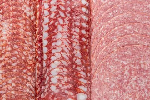 Sausage background texture, pattern from sausage slices. Stock Photos