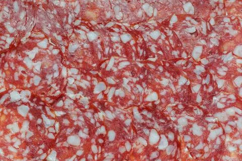 Sausage background texture, pattern from sausage slices. Stock Photos