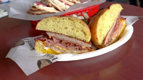 Sausage bacon ham cheese on a roll Stock Footage 131919540