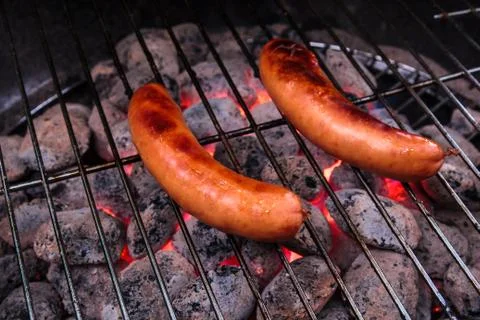 Sausage barbecuing Stock Photos