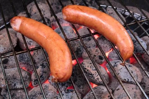 Sausage barbecuing Stock Photos
