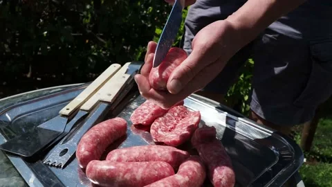 Sausage for barbeque, preparing Italian sausages for grilling Stock Footage