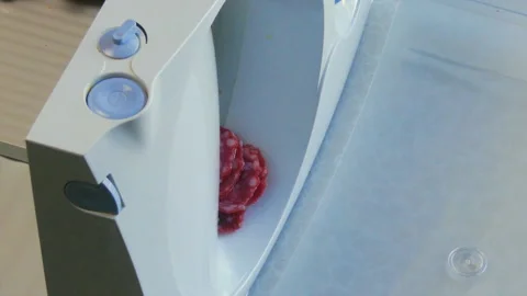 Sausage Being Cut on Special Machine Vídeo Stock 100510765
