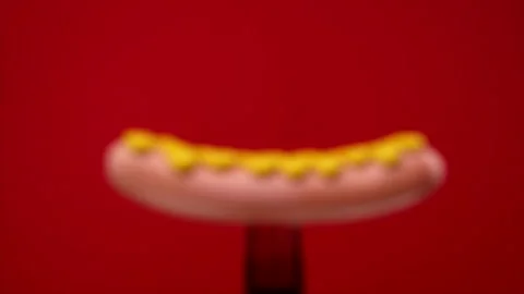 Sausage on black fork red background. the camera zooms in on the subject 動画素材 132186461