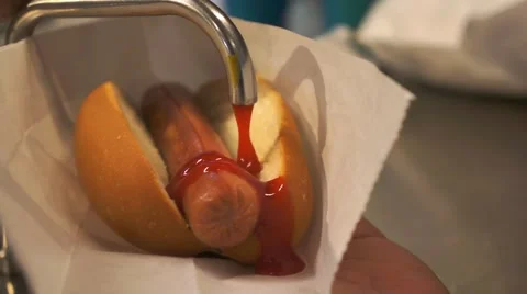 Sausage with bread put chili sauce Stock Footage 66419473