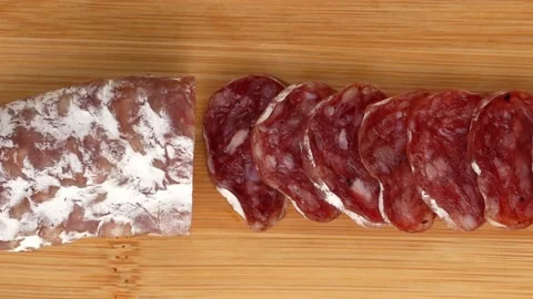 Sausage cut on a board. Video stock 138582118