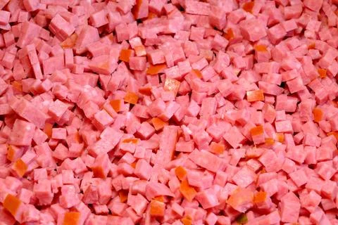 Sausage cut into small tiny pieces in large quantities Foto stock