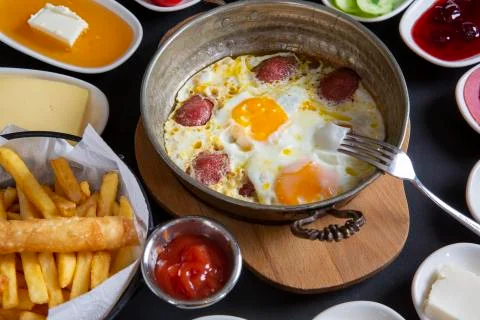 Sausage with egg in copper Stock Photos