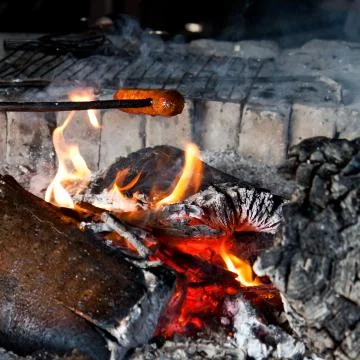 Sausage on fire Stock Photos