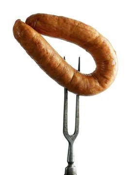 Sausage on fork isolated Fotos de archivo