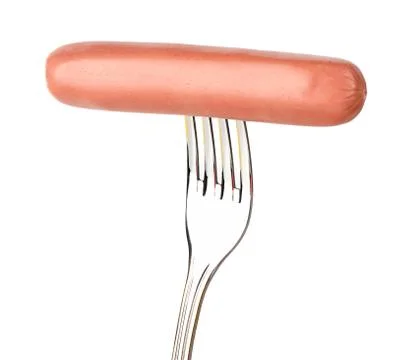 Sausage on a fork Stock Photos