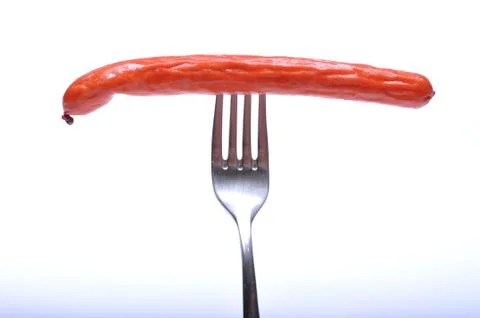 Sausage on fork Stock Photos