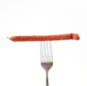 Sausage on a fork Stock Photos