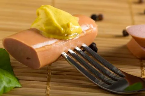 Sausage in fork Stock Photos