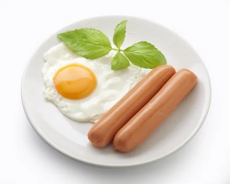 Sausage with fried egg Stock-Fotos