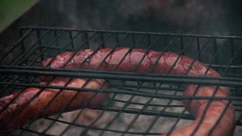 Sausage fry on the grill Stock Footage 137828100