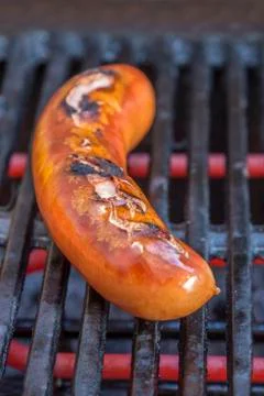 Sausage on a grill Stock Photos