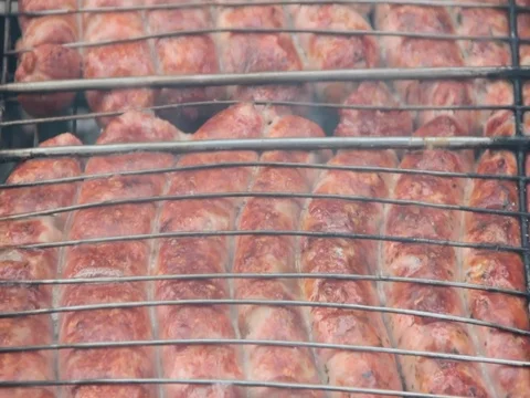 The sausage is grilled Stock Footage 76984998