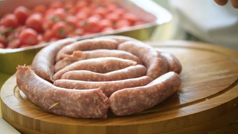 Sausage preparation for bbq Stock Footage 93513012