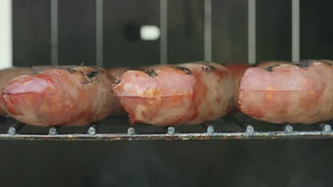 Sausage on a rack smoking Stock Footage 287153192