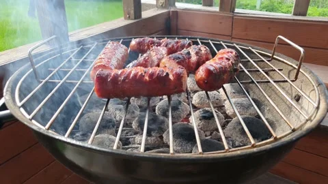 The sausage is roasting on the grill. 스톡 동영상 159274527