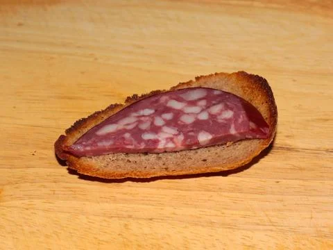 A sausage on a slice of bread Stock Photos