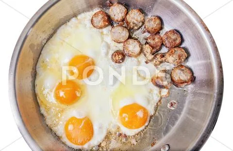 Sausage slices and eggs Stock Photos