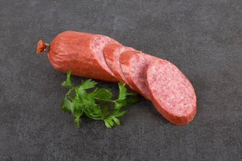 Sausage on a stone background Stock Photos