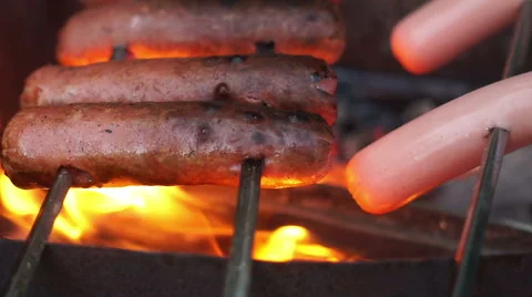 Sausages are fried on fire Stock Footage 68937643