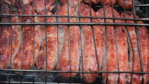 Sausages are fried on a grate Stock Footage 87795571