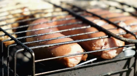 Sausages on the barbecue grill Stock Footage 63847853
