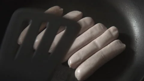 Sausages being cooked in a pan Stock Footage 137601312