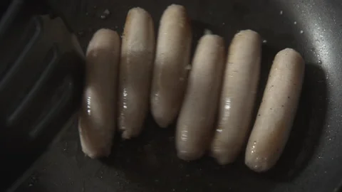 Sausages being cooked in a pan Stock Footage 137605205