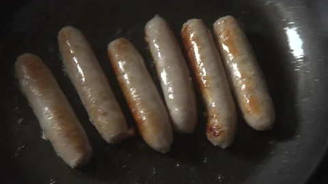 Sausages being cooked in a pan Stock Footage 137606804