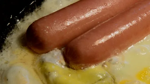Sausages with chicken eggs Stock Footage 250206210