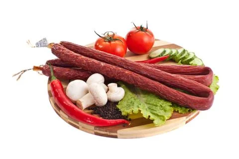 Sausages in composition with vegetables Stock Photos