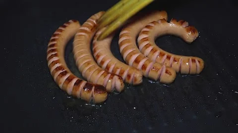 Sausages cooking Stock Footage 46294870