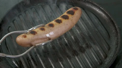 Sausages cooking Stock Footage 112589809