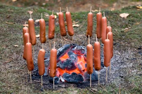Sausages on fire Stock Photos