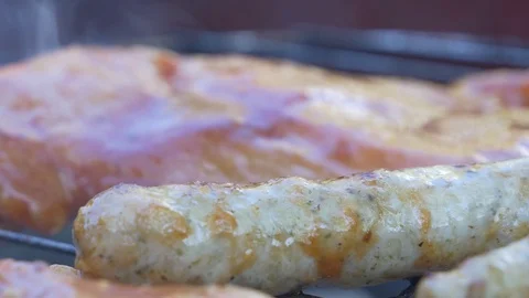 Sausages frying on a grill 스톡 동영상 129957073