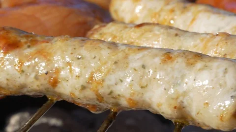 Sausages frying on a grill 스톡 동영상 129957082