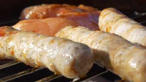 Sausages frying on a grill 스톡 동영상 129957091