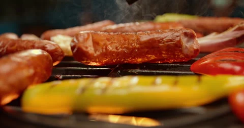 Sausages getting cooked on the grill Stock-Footage 311829414