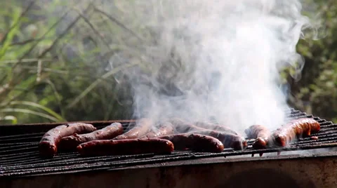 Sausages on grill Vídeos de archivo 27797666