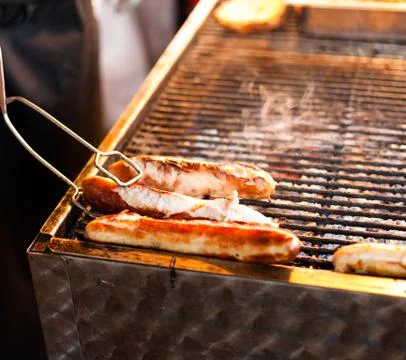 Sausages on the grill Stock Photos