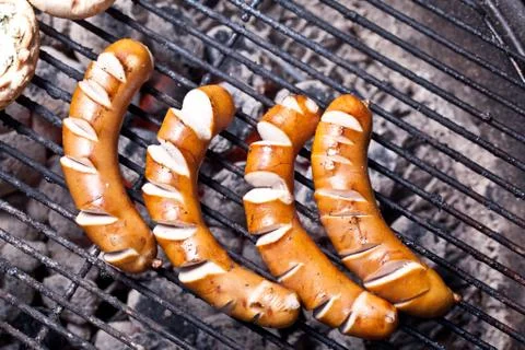 Sausages on grill Fotos de archivo